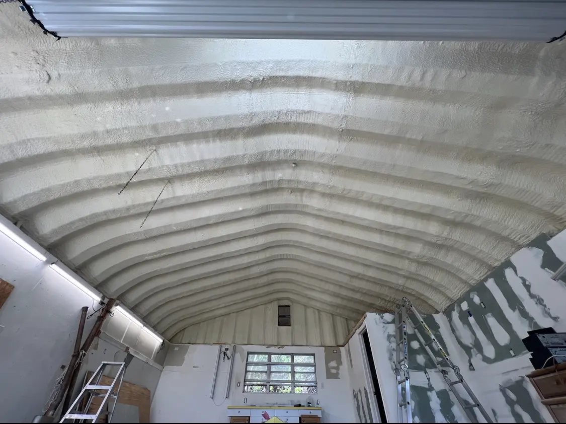 Spray polyurethane foam applied to the underside of a metal roof deck in Shorewood